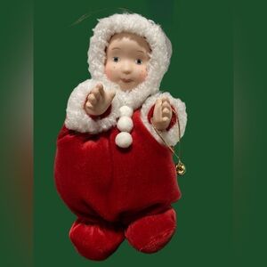 1994 Christmas decoration with porcelain face and hands 5 3/4 inches high